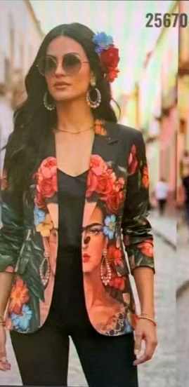Model wearing a floral printed blazer with a portrait motif